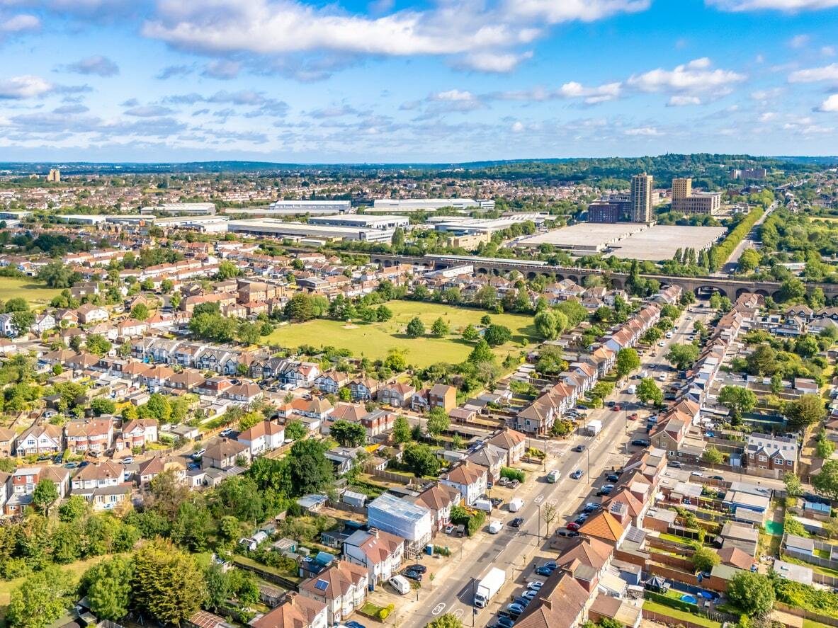 Aerial view of community in London, showing roads, houses and green space