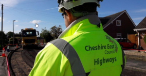 A man in a Cheshire East Council Highways safety jacket
