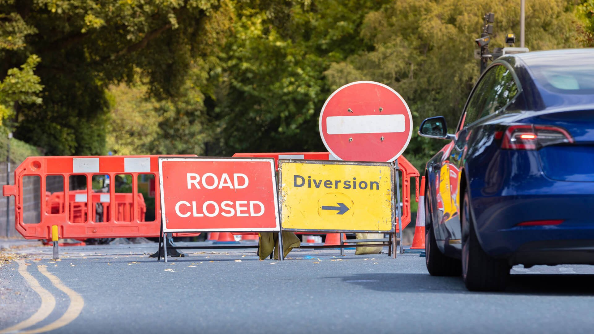 road closed diversion car stop sign traffic